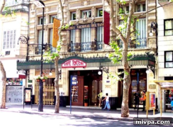 The grand exterior of Cafe Tortoni in Buenos Aires, a historic landmark on Avenida de Mayo.