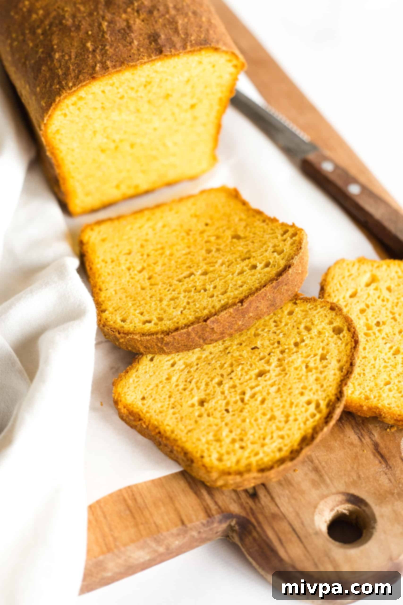 Sliced loaf of yeasted pumpkin bread.
