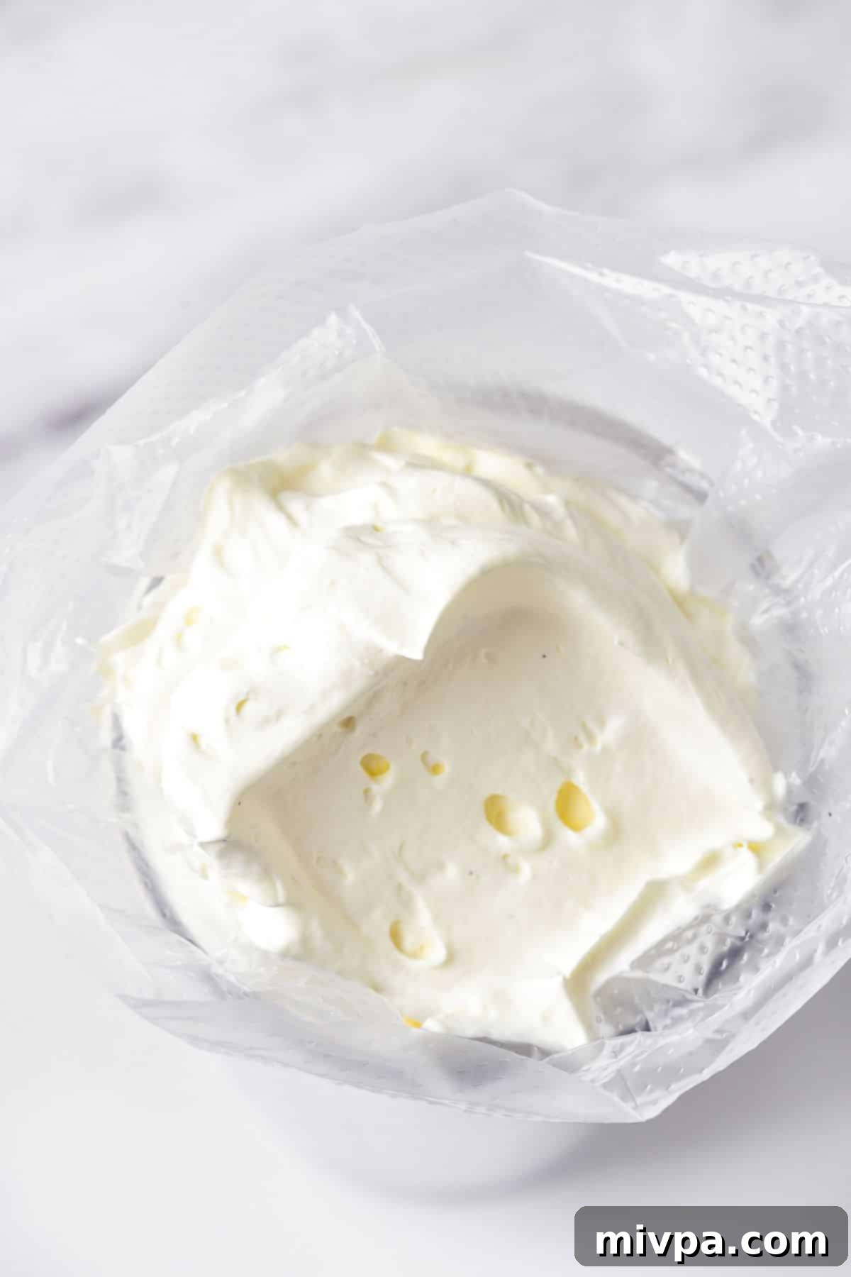 Whipped cream in piping bag