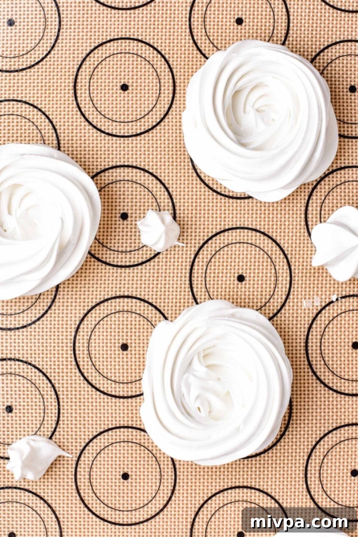 Piped meringue on silpat.