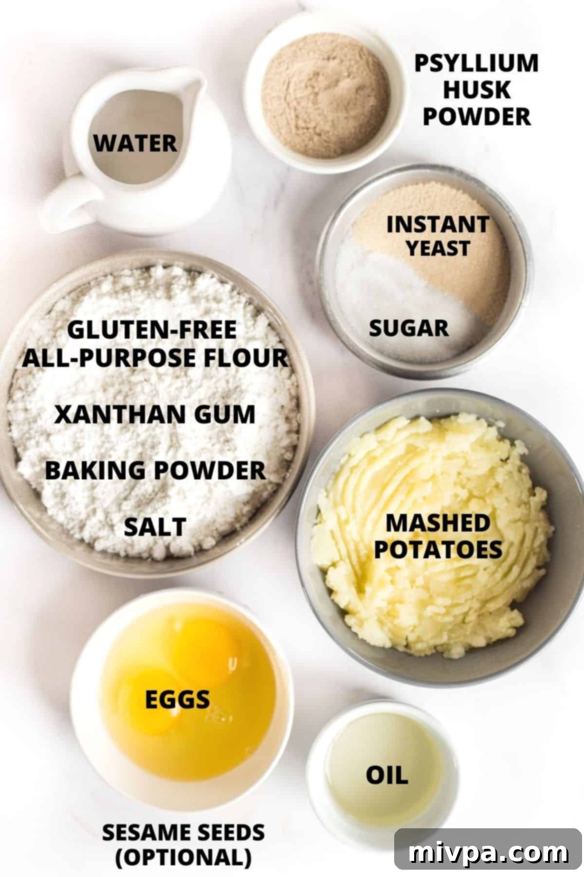 All ingredients for gluten-free slider buns meticulously laid out on a marble board, ready for preparation.