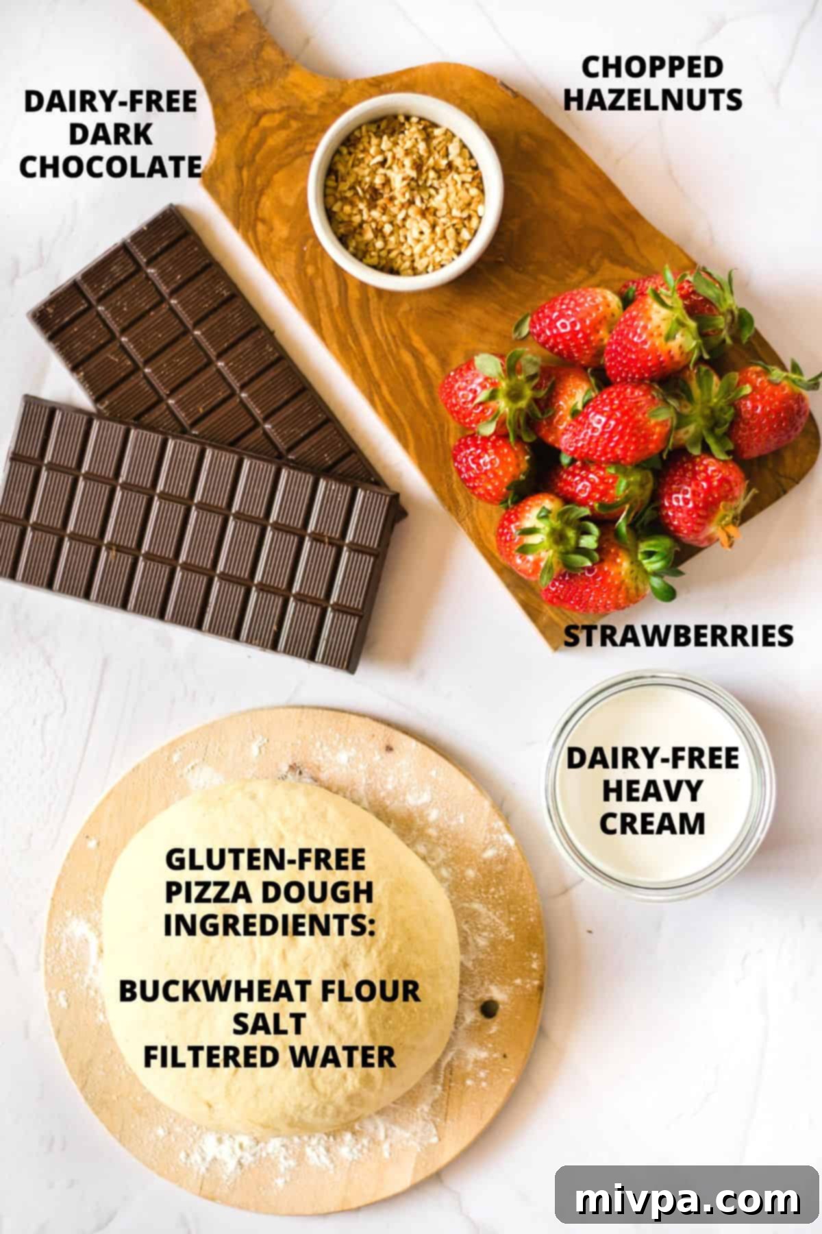 Ingredients for chocolate dessert pizza laid out on marble board.