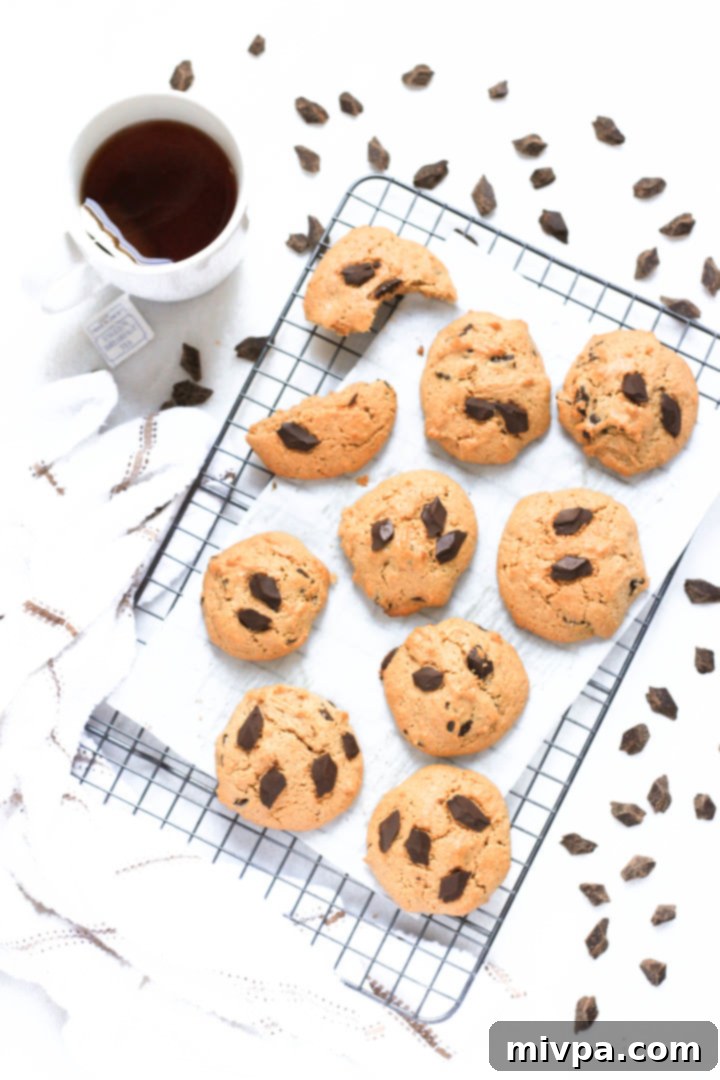 Almond Chocolate Chip Cookies (Gluten-Free, Dairy-Free) Freshly baked gluten-free almond chocolate chip cookies cooling on wire rack.