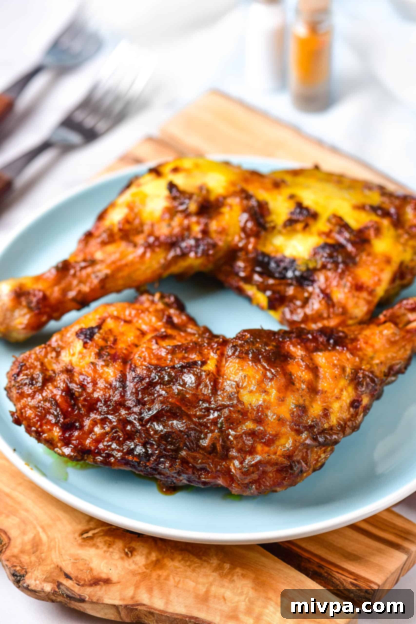 Air Fryer Chicken Leg Quarters (Gluten-Free, Dairy-Free) A plate with air fryer chicken leg quarters.