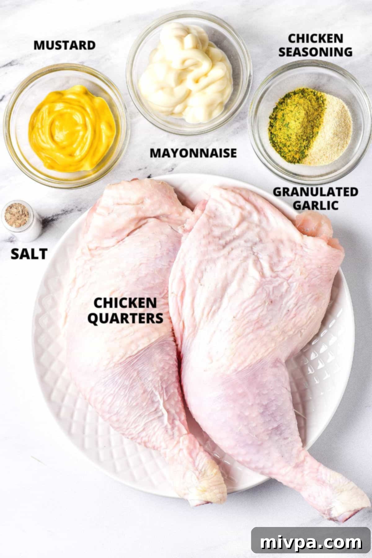 Air Fryer Chicken Quarters (Gluten-Free, Dairy-Free) Ingredients for chicken leg quarters laid out on marble board.