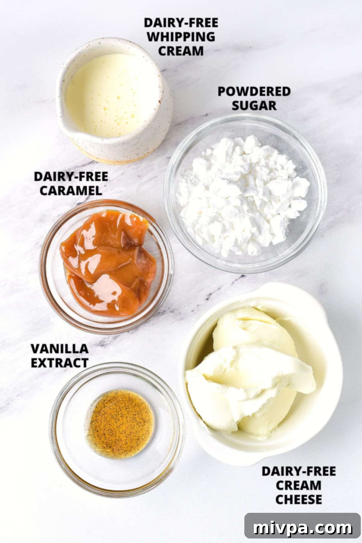 Ingredients for frosting laid out on marble board.