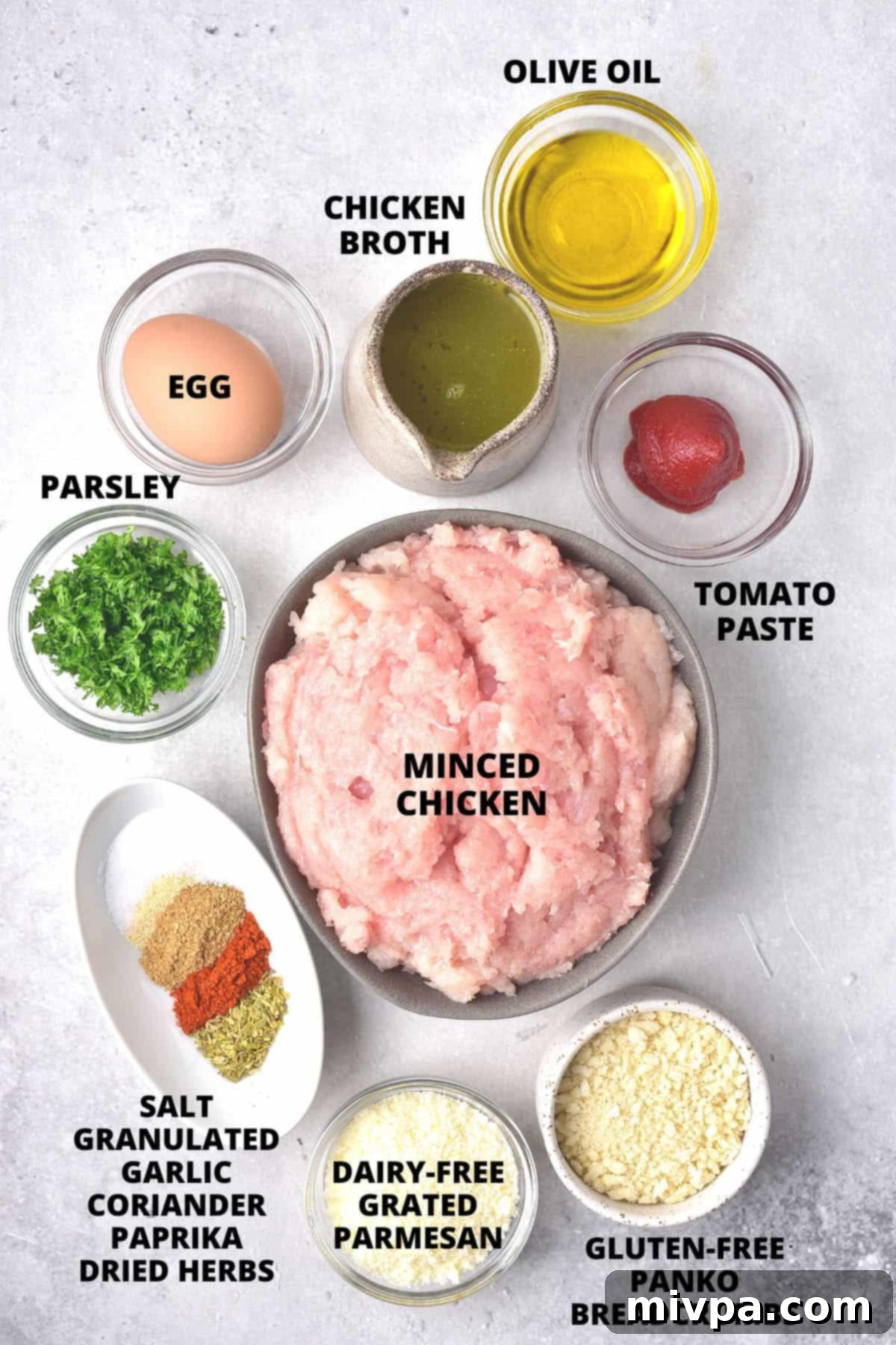 Ingredients for gluten-free chicken meatballs laid out on board.