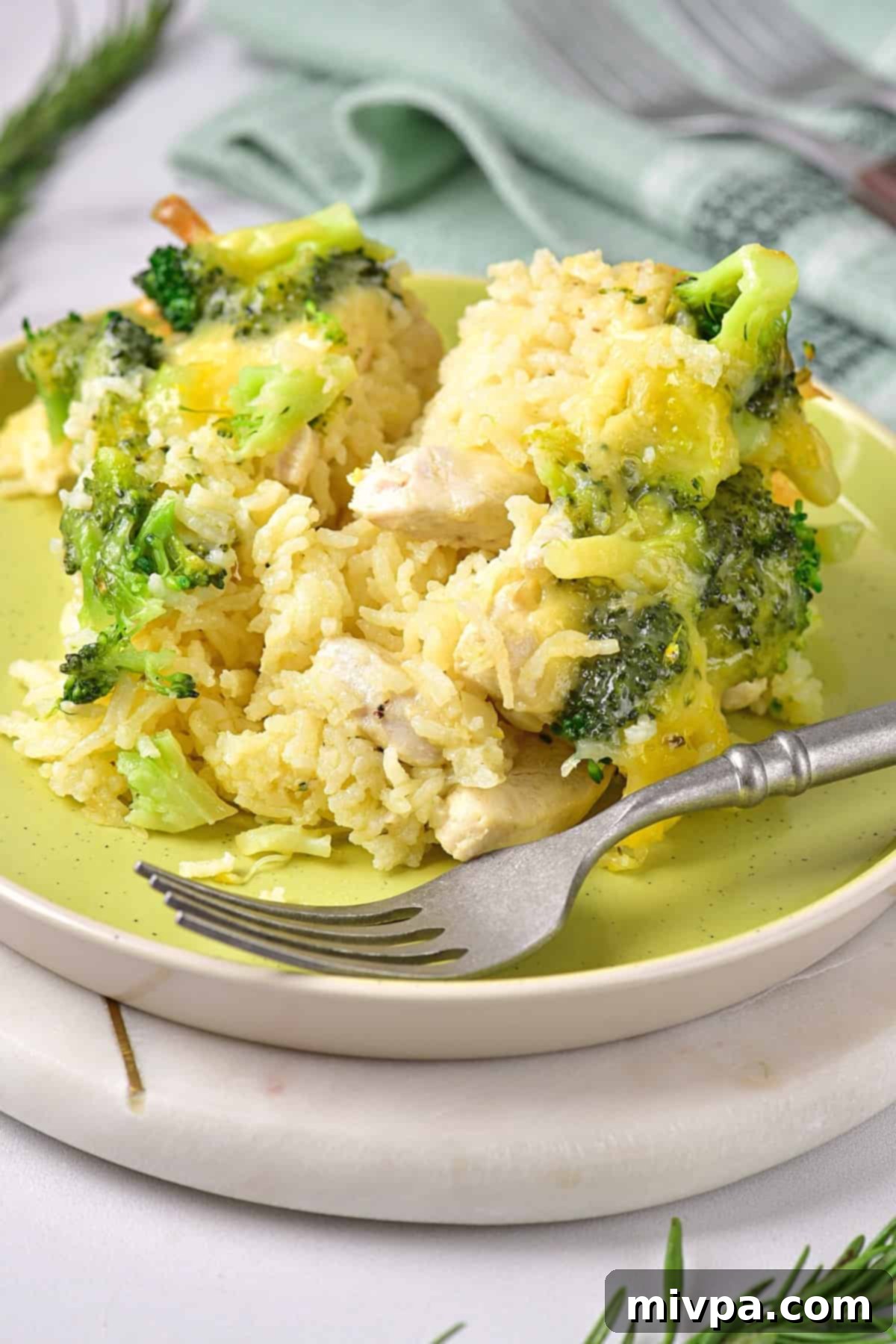 Gluten-Free Chicken Rice Casserole (Dairy-Free) A fork on a plate of hearty gluten-free dairy-free chicken casserole, ready to be enjoyed.