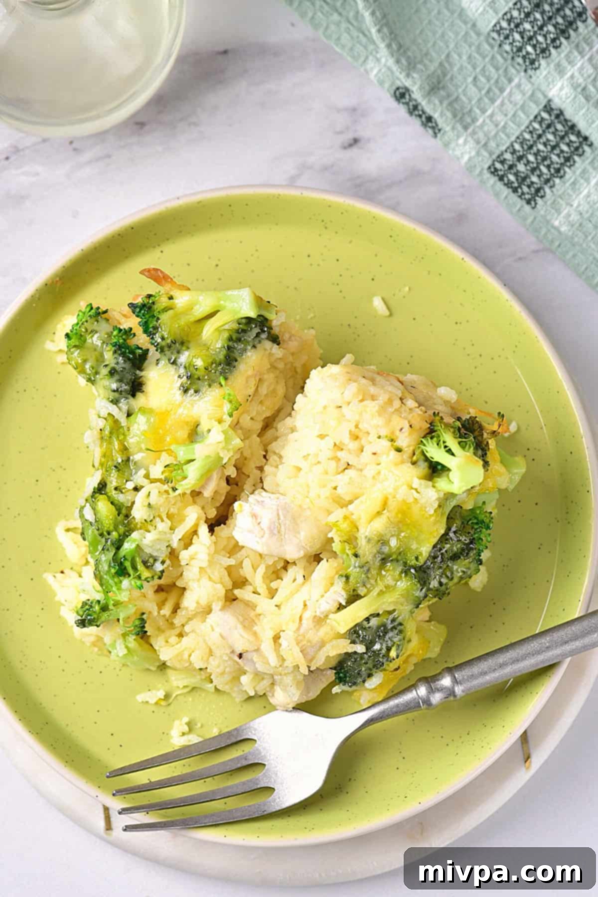 Gluten-Free Chicken Broccoli Casserole (Dairy-Free) Top down view of a plate with a generous serving of gluten-free dairy-free chicken casserole, showing the rice, chicken, and broccoli.