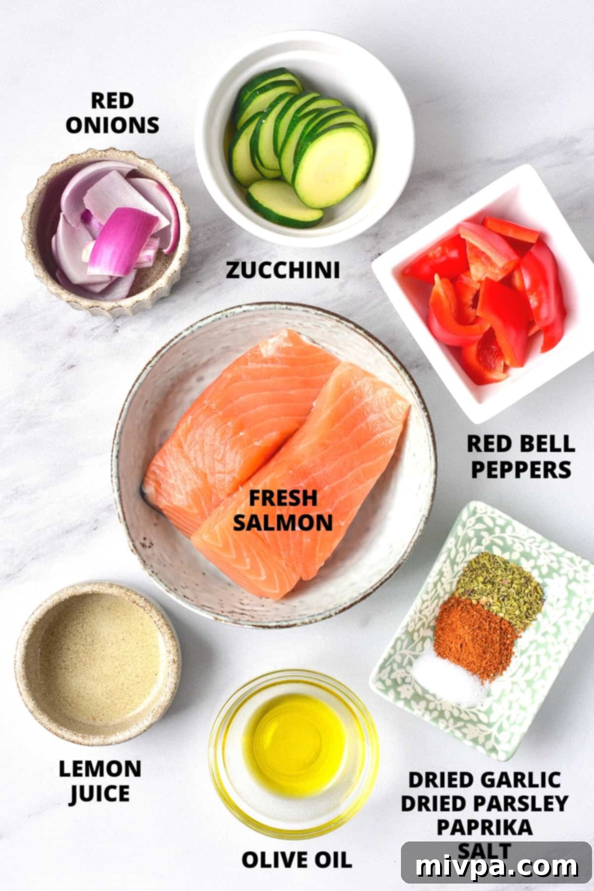 Salmon Kabobs in the Oven (Gluten-Free, Dairy-Free) Ingredients for baked salmon kabobs laid out on marble board.