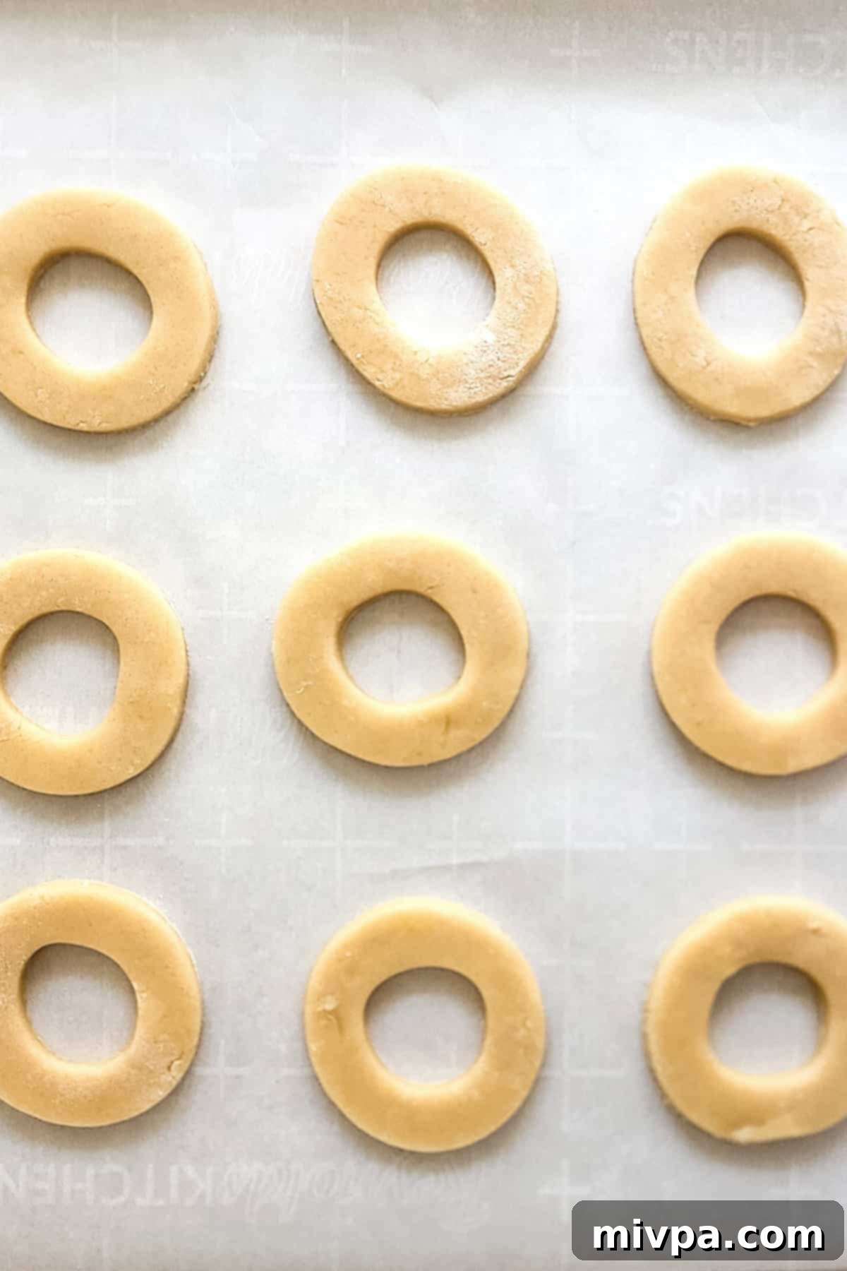 Gluten-Free Samoa Cookies Recipe (Dairy-Free) Cut out dough circles on parchment paper.
