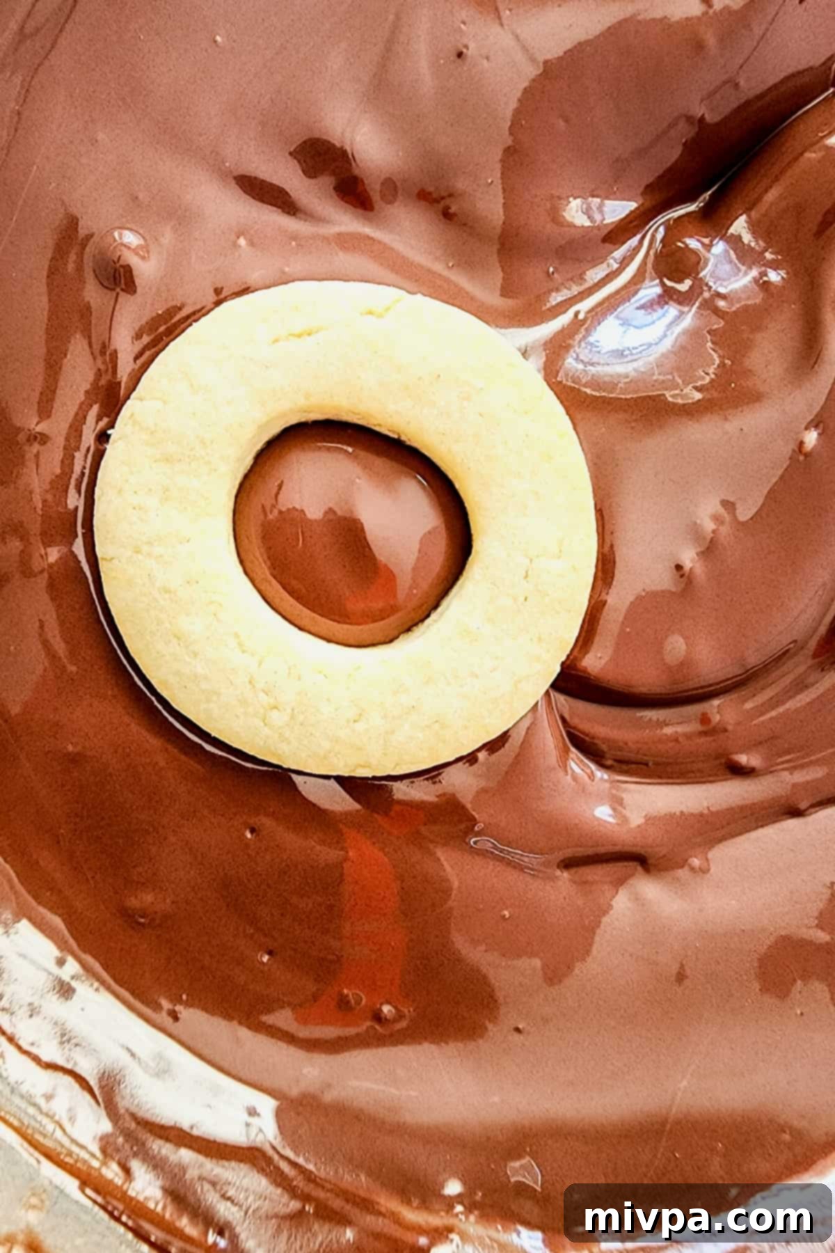 Gluten-Free Samoas Cookies (Dairy-Free) A cookie on melted chocolate.