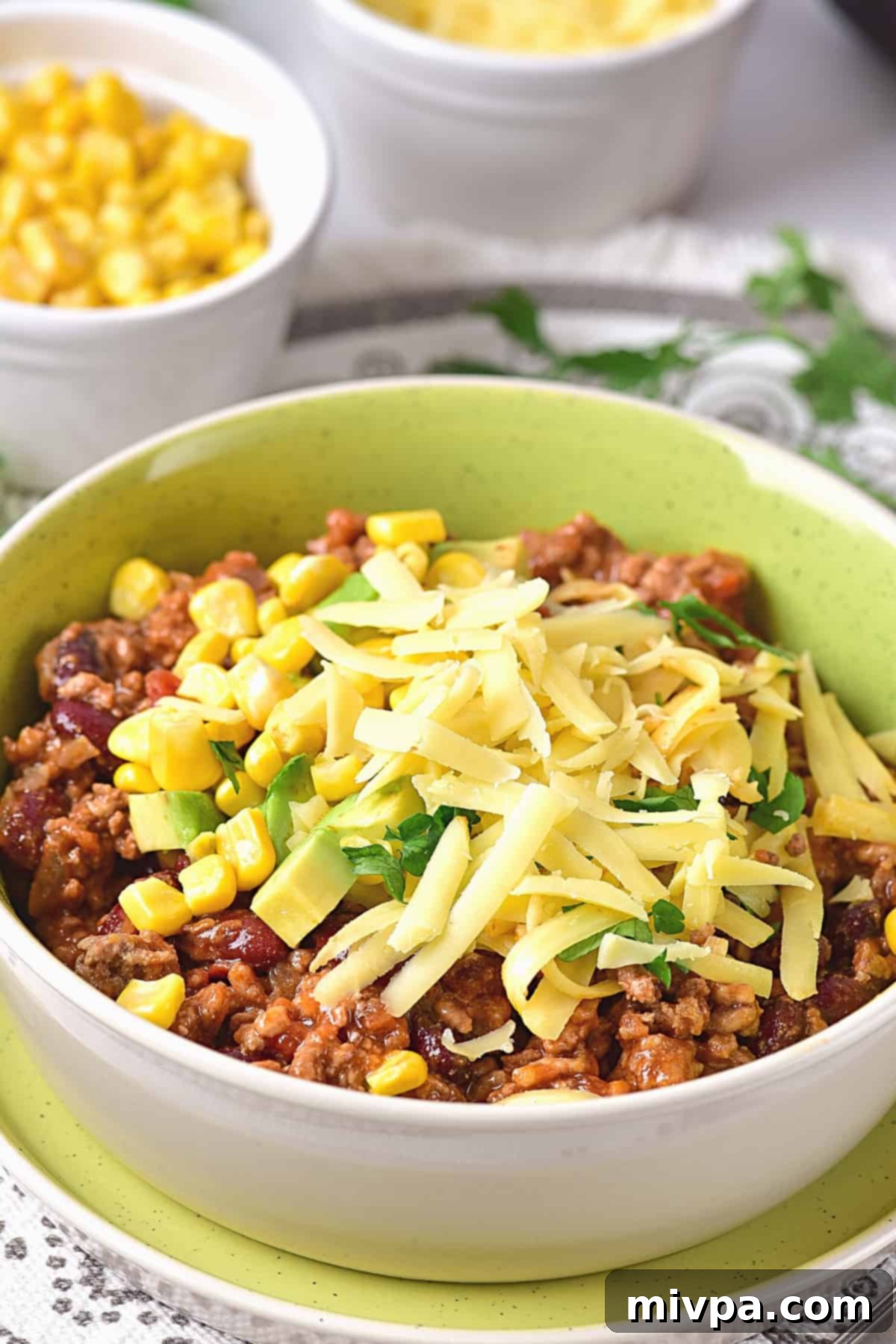 Angled view of a bowl of Dutch oven chili con carne.