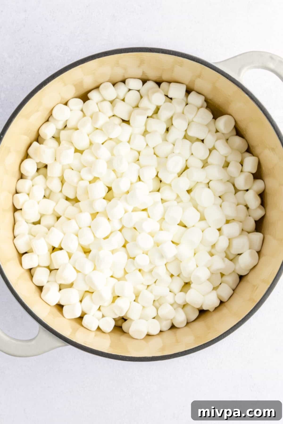 A large pot of melting mini marshmallows and butter.