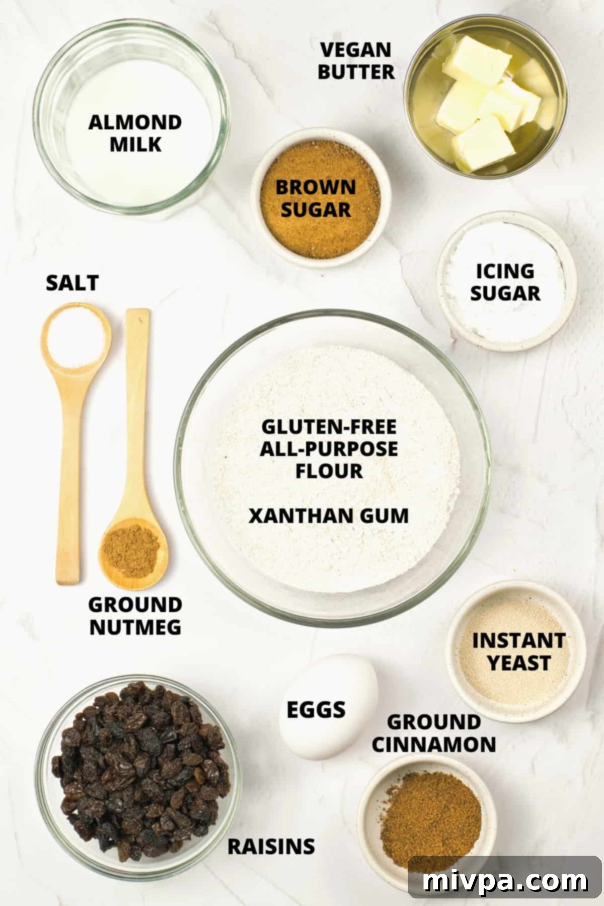 A flat lay of all the ingredients needed for gluten-free dairy-free hot cross buns.