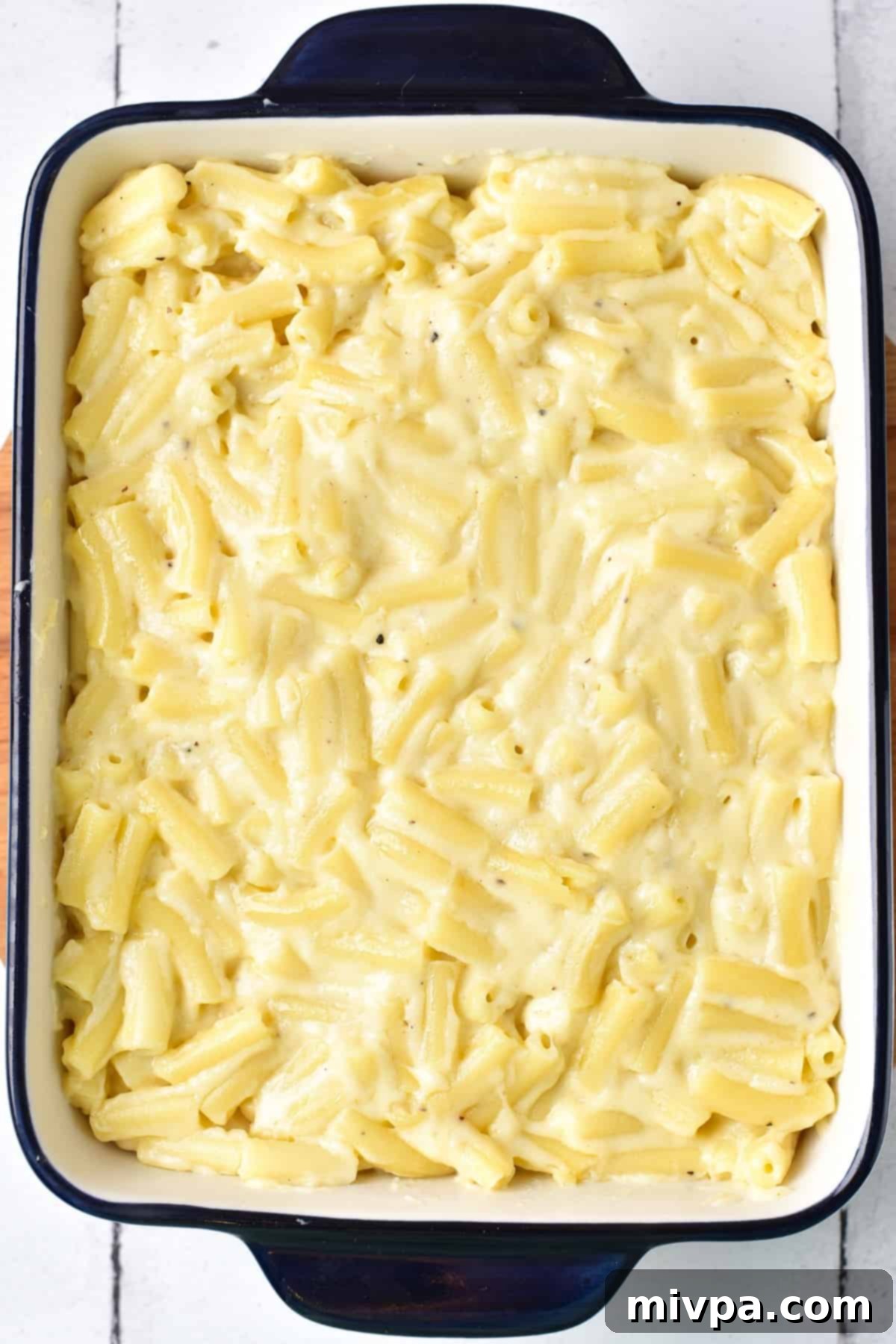 Macaroni and cheese mixture in a casserole dish.