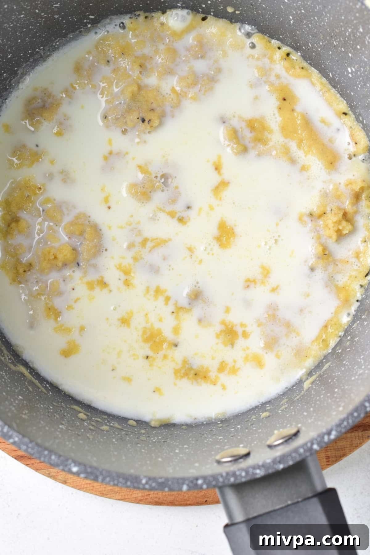 Milk mixture in saucepan.