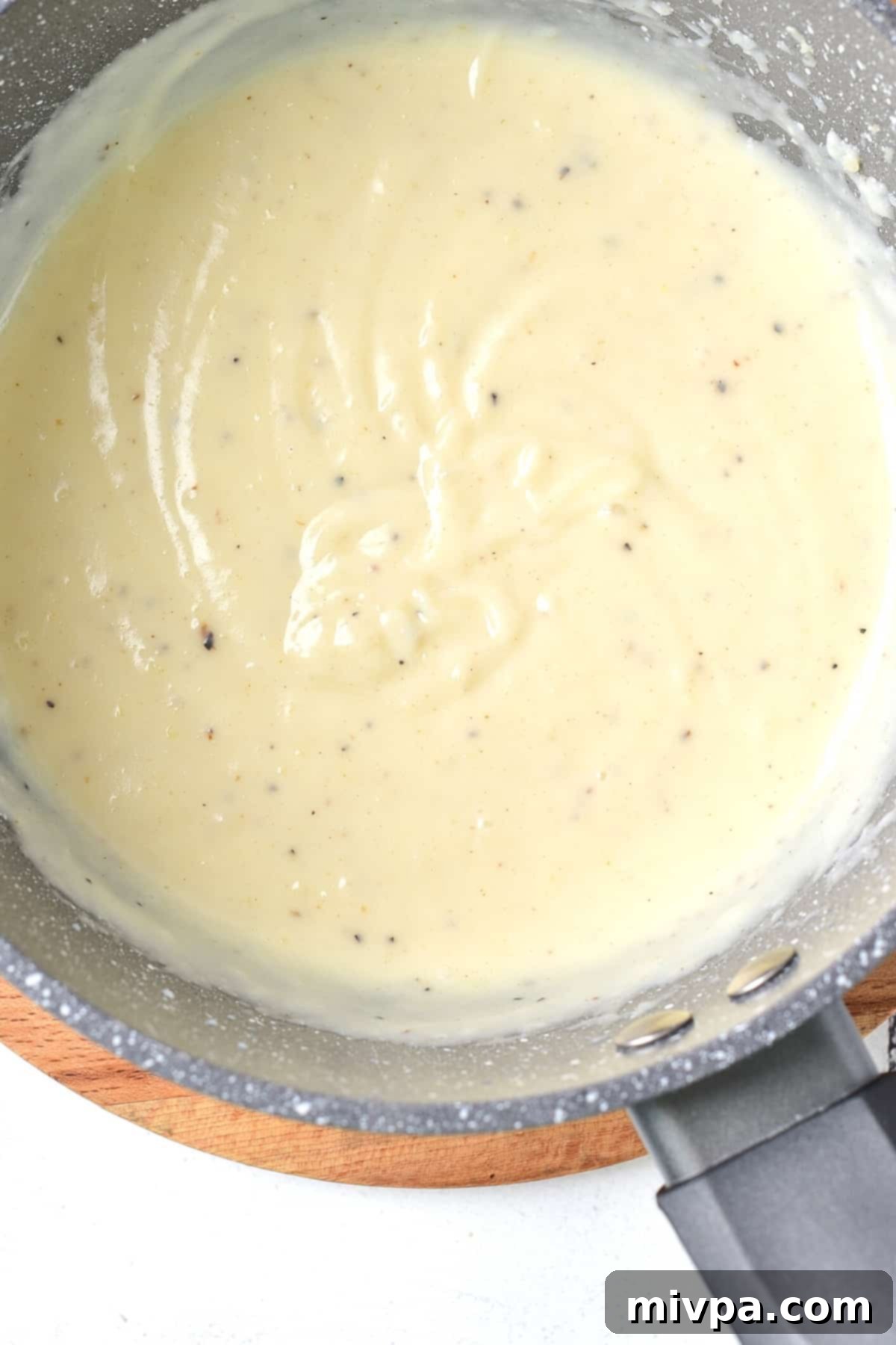 Creamy mixture in saucepan.