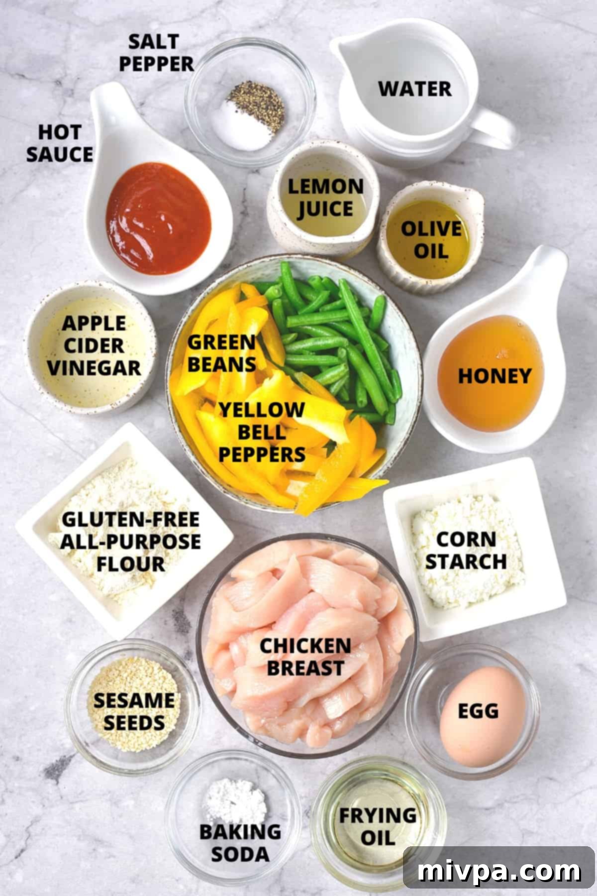 A flat lay of all the essential ingredients for making homemade Panda Express honey sesame chicken. This includes boneless, skinless chicken breasts, yellow bell peppers, green beans, gluten-free all-purpose flour, cornstarch, baking soda, an egg, olive oil, salt, ground black pepper, honey, gluten-free hot sauce, apple cider vinegar, lemon juice, filtered water, and white sesame seeds, all neatly arranged for an easy cooking experience.