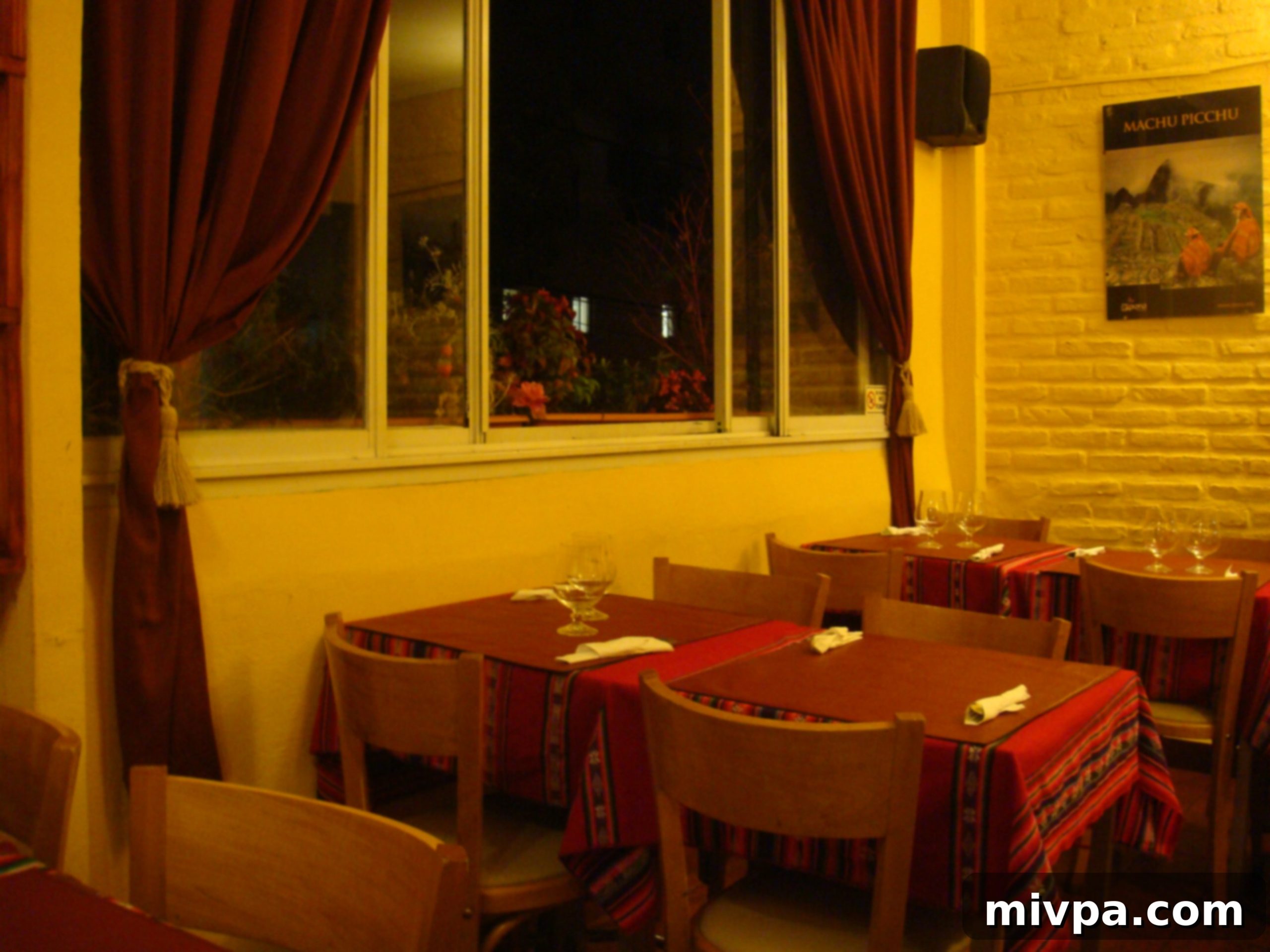 The charming upper terrace of Primavera Trujillana restaurant, offering a cozy dining atmosphere.
