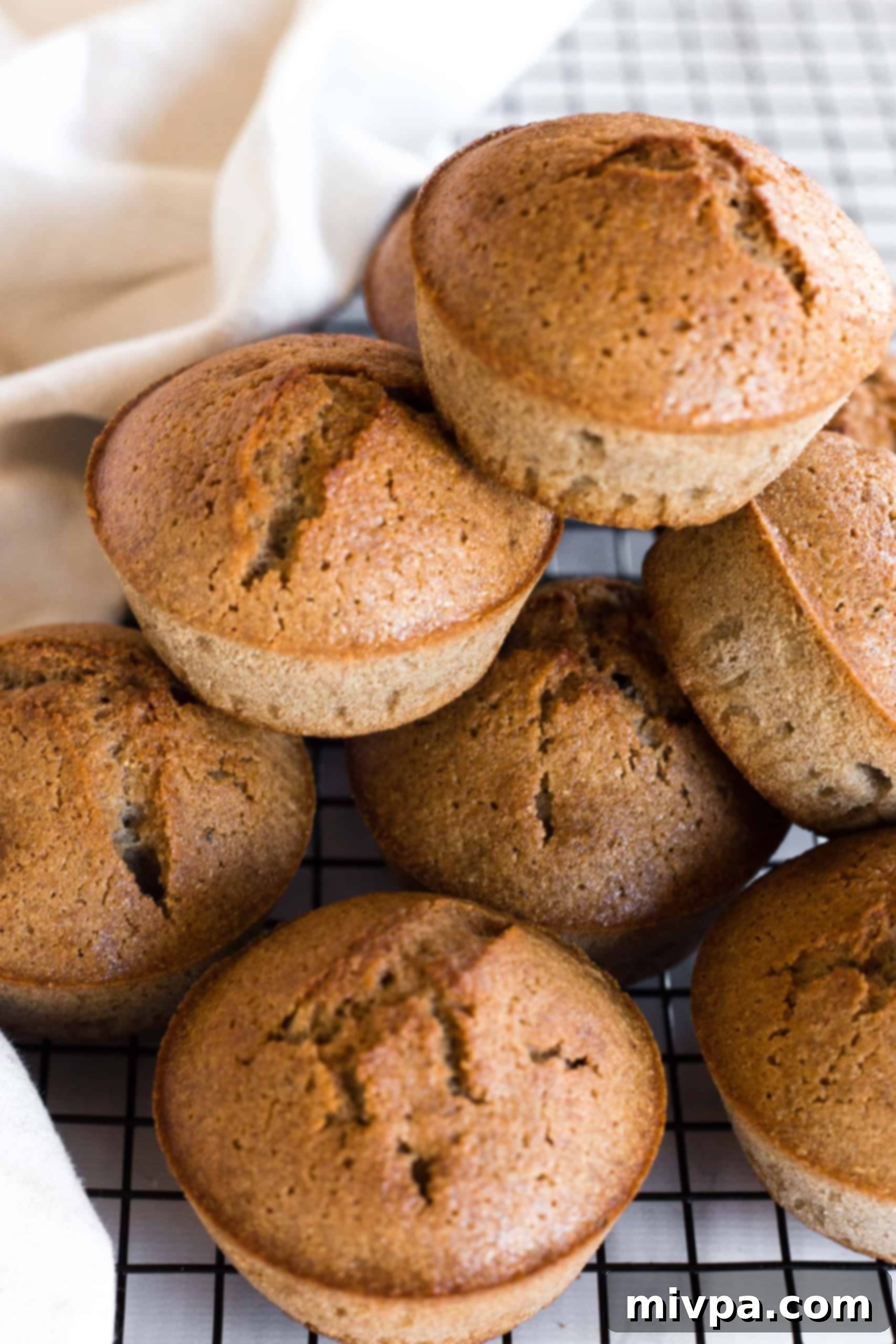 Easy Buckwheat Muffins Recipe (Gluten-Free, Dairy-Free) A stack of golden-brown buckwheat muffins on a wire rack, ready to be enjoyed.