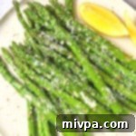 A small plate of air-fried parmesan asparagus.