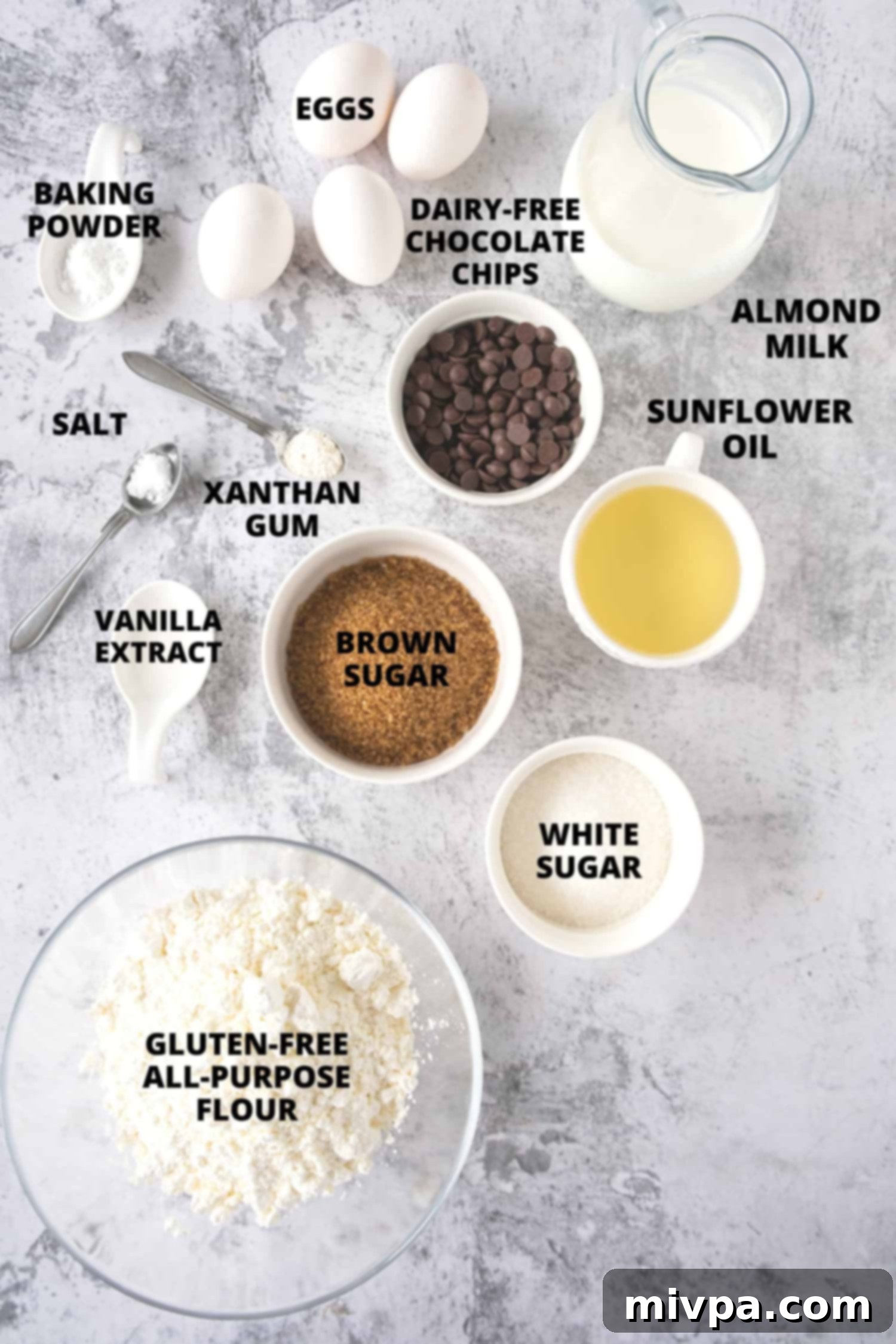 Gluten-Free Chocolate Chip Muffins (Dairy-Free) All the ingredients for gluten-free chocolate chip muffins carefully laid out on a wooden board, ready for baking.