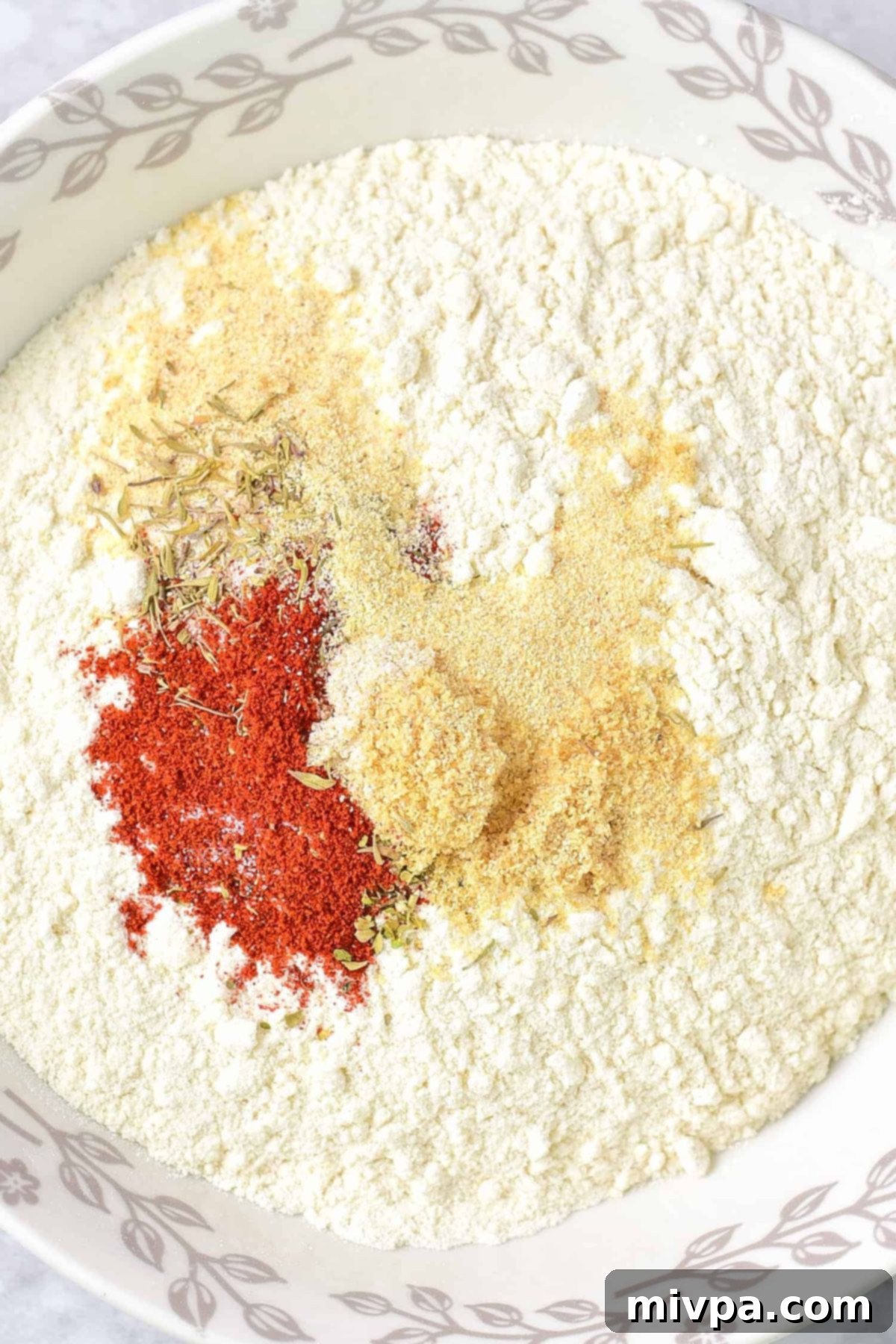 Dairy-Free Fried Chicken (Gluten-Free) A bowl filled with the perfectly mixed condiments and gluten-free flour mixture, ready for coating.