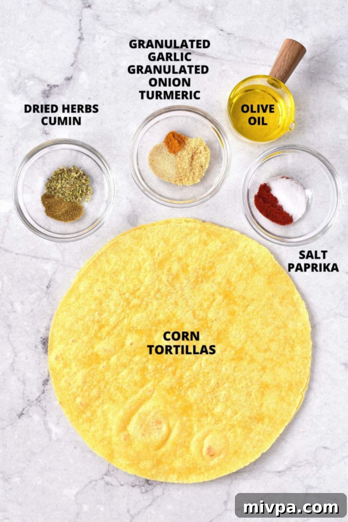Ingredients for air fryer tortilla chips recipe laid out on board.