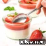 Plant-Based Gluten-Free Coconut Panna Cotta 2 Scooping into vegan panna cotta with strawberry