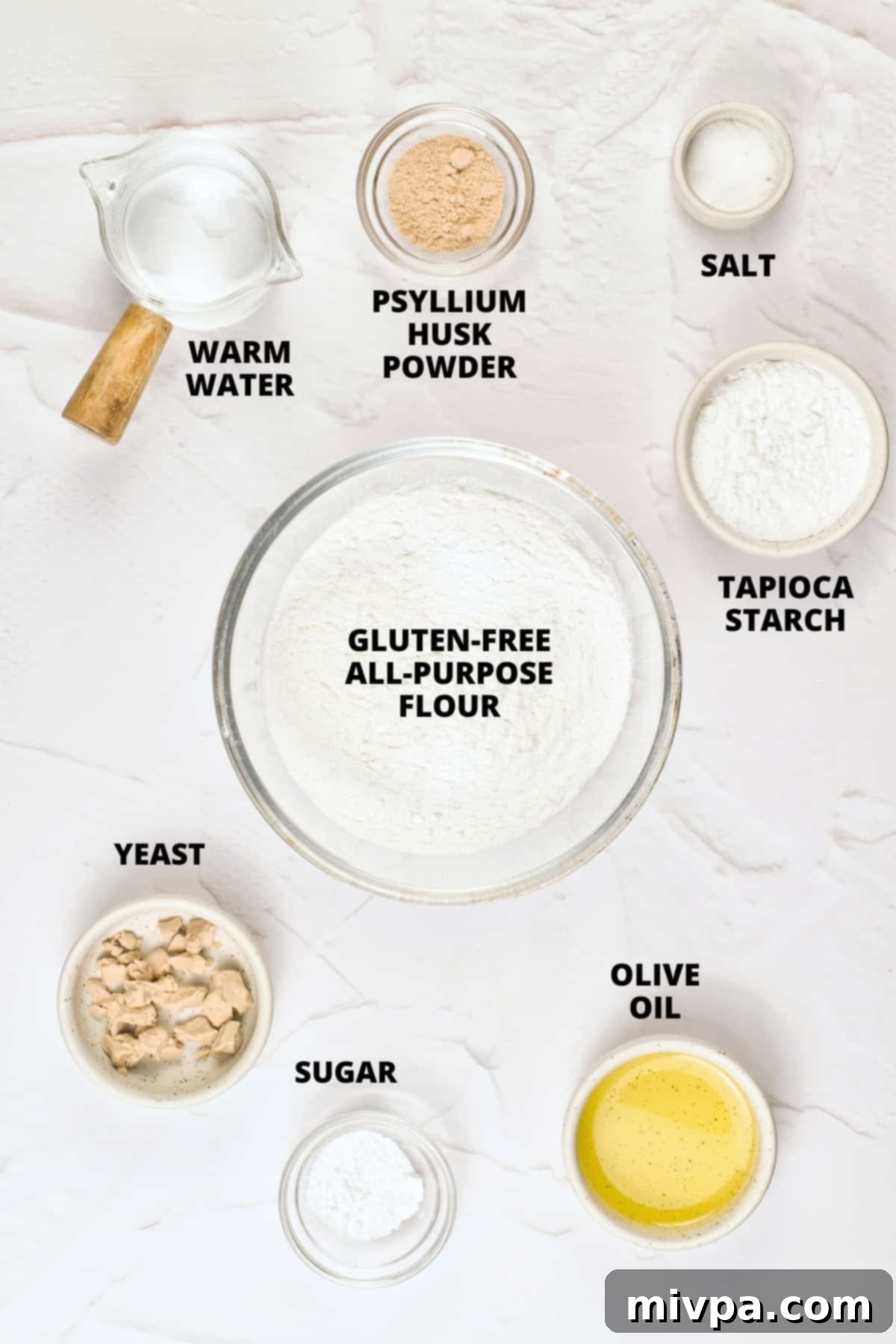 Gluten-Free Pita Bread Recipe (Dairy-Free, Vegan) All the necessary ingredients for the gluten-free pita bread recipe, neatly laid out on a marble board.