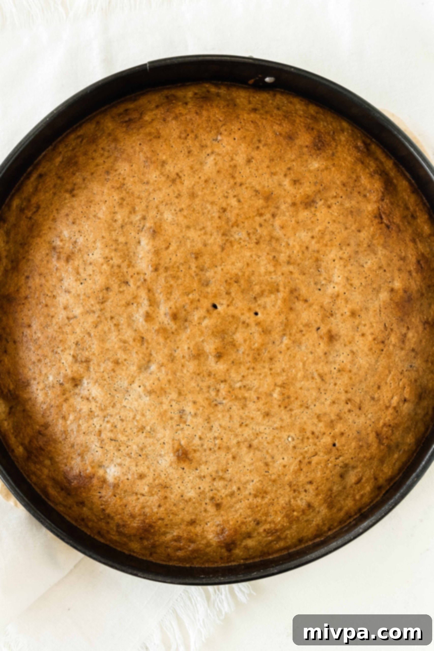 Banana Cake Recipe (Gluten-Free, Dairy-Free) Freshly baked banana cake in springform pan.