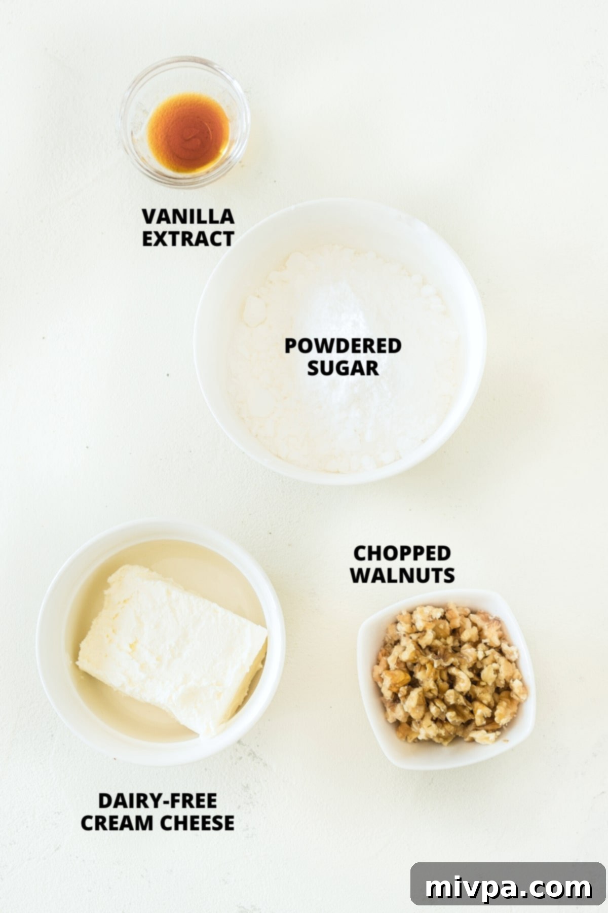 Easy Gluten-Free Banana Cake (Dairy-Free) Ingredients for cream cheese frosting laid out on board.