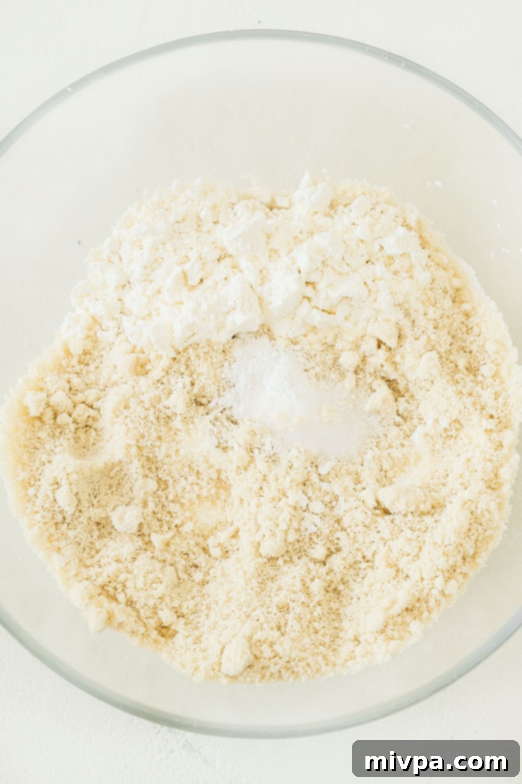 Easy Gluten-Free Dairy-Free Banana Cake Recipe Dry ingredients in a glass mixing bowl.