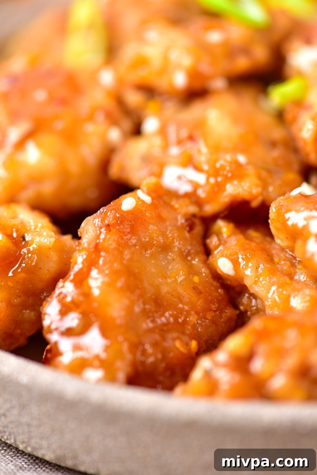 Panda Express Orange Chicken (Gluten-Free, Dairy-Free) A close-up shot revealing the delightful texture and glossy coating of homemade Panda Express-style orange chicken.