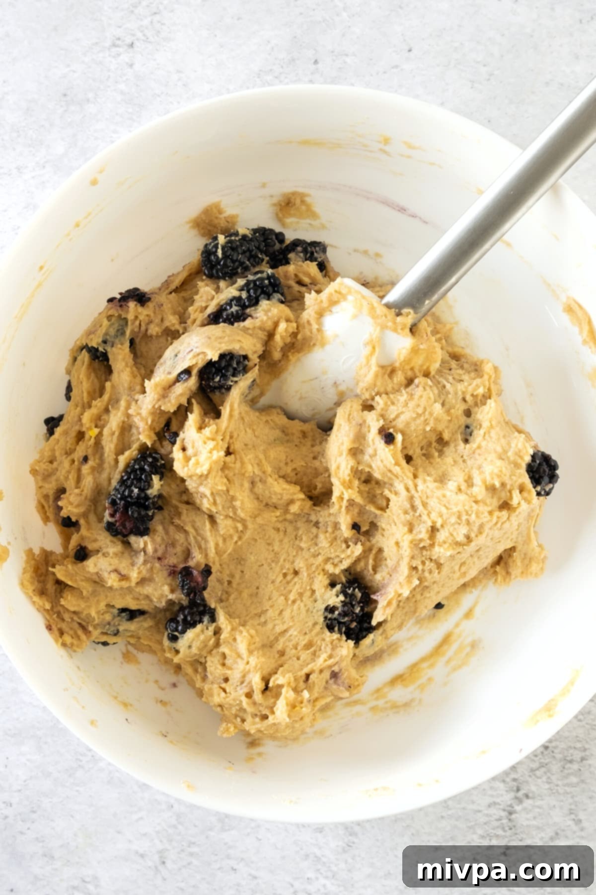 Gluten-Free Blackberry Scone Recipe (Dairy-Free) Blackberries Folded Blackberries being gently folded into the scone dough in a mixing bowl.