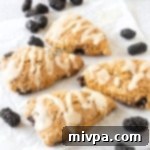 Gluten-Free Blackberry Scones (Dairy-Free) Thumbnail A perfectly baked gluten-free blackberry scone, dairy-free and ready to eat.