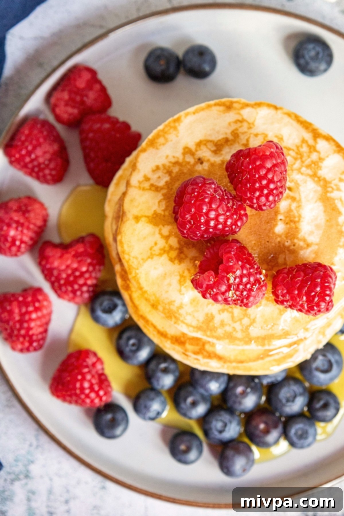 Top down view of gluten free  buttermilk pancakes on plate.