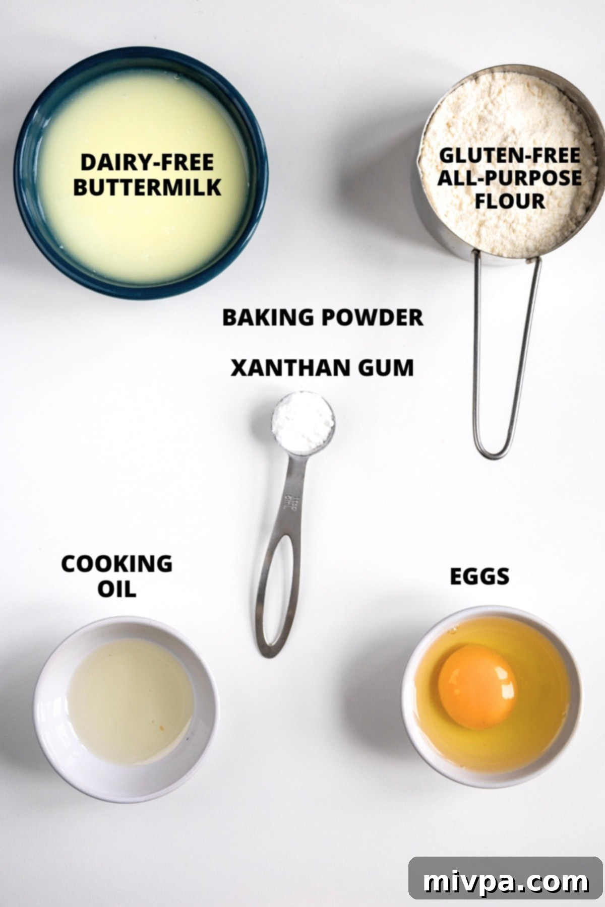 Ingredients for gluten-free buttermilk recipe laid out on white board.