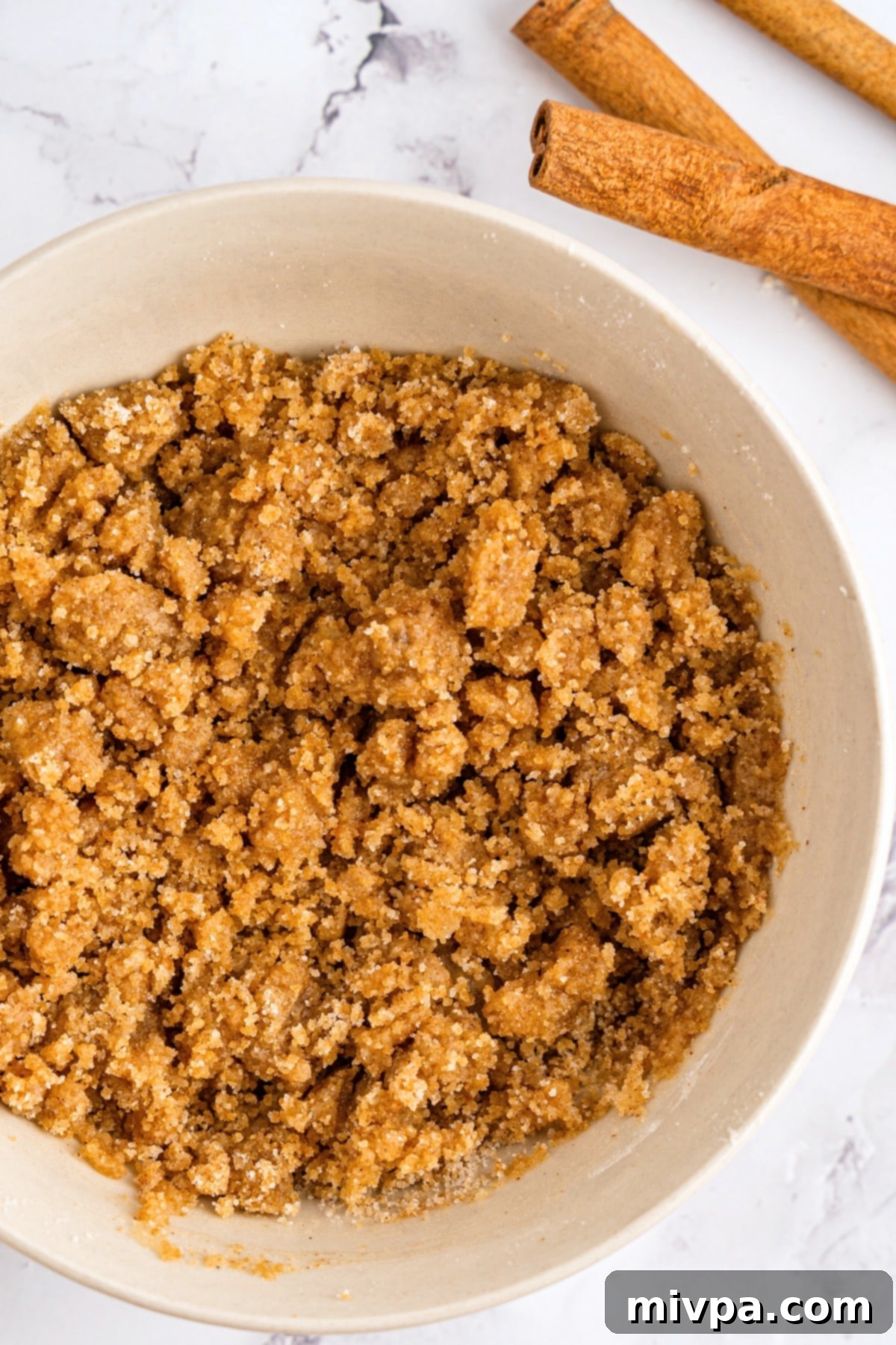 Streusel topping in white bowl.