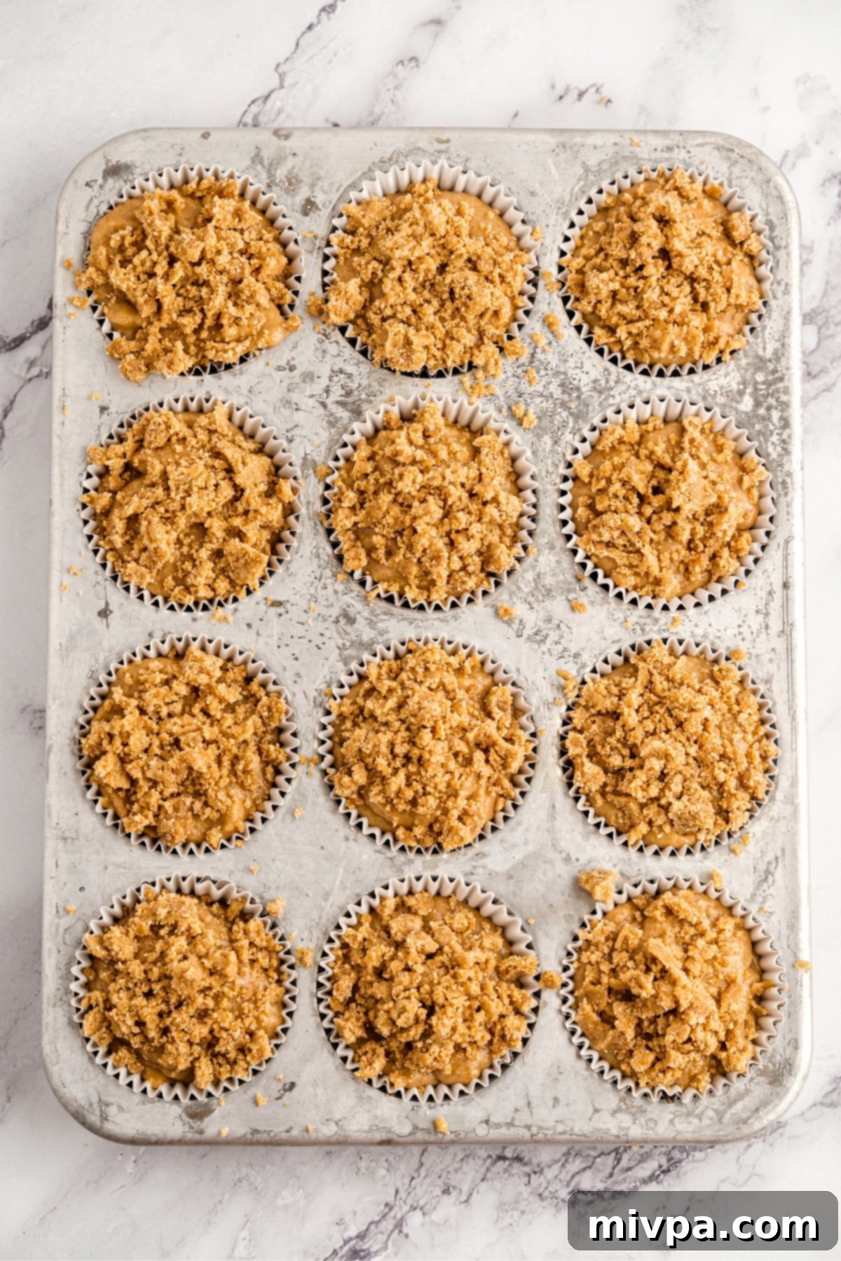 Muffin batter in muffin pan.