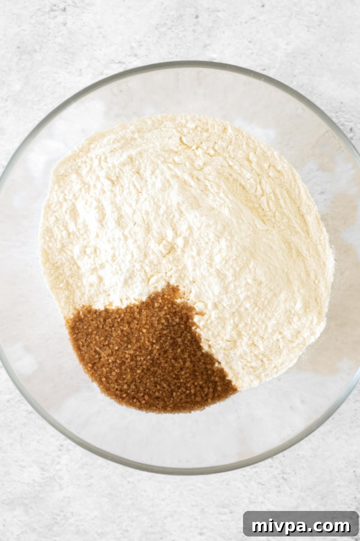 Easy Apple Tart (Gluten-Free, Dairy-Free) Dry ingredients for tart crust in a large glass bowl.