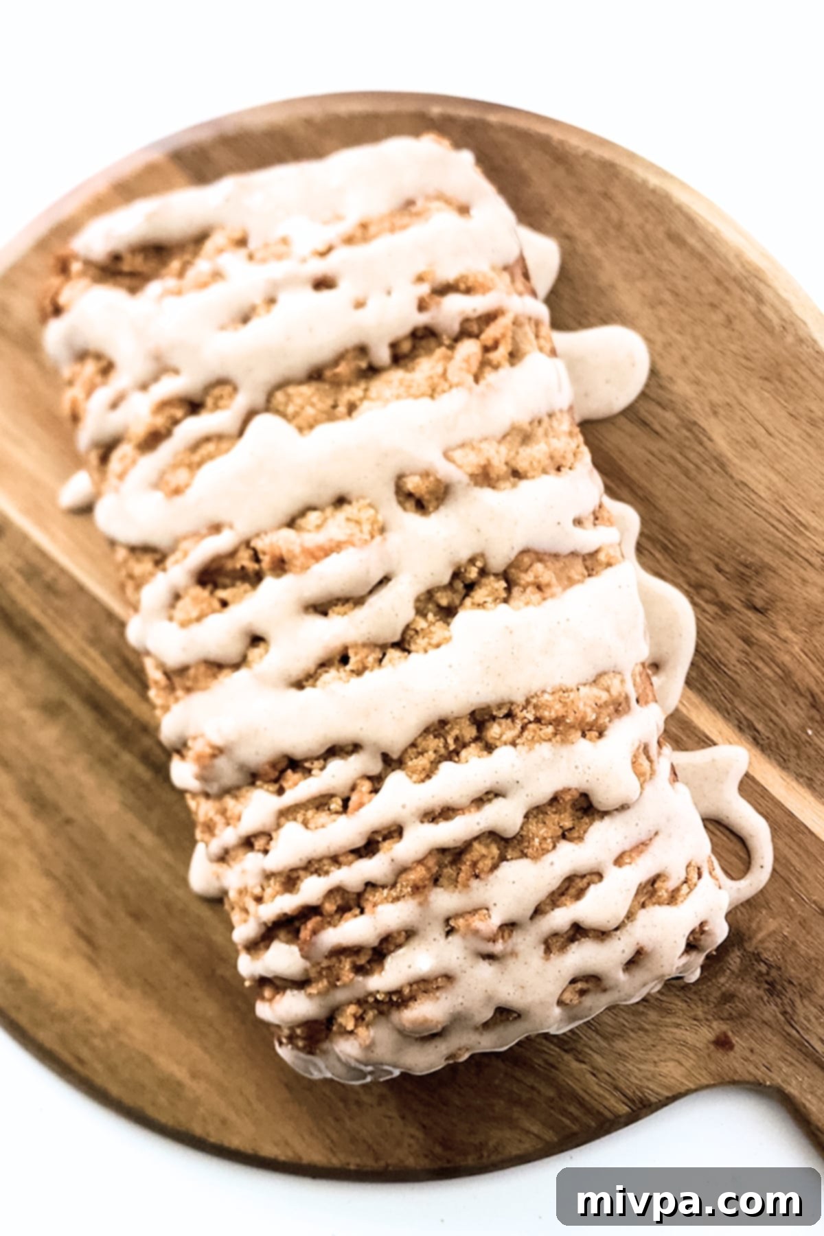 Gluten-Free Apple Bread (Vegan) Gluten-free apple bread beautifully drizzled with cinnamon glaze.