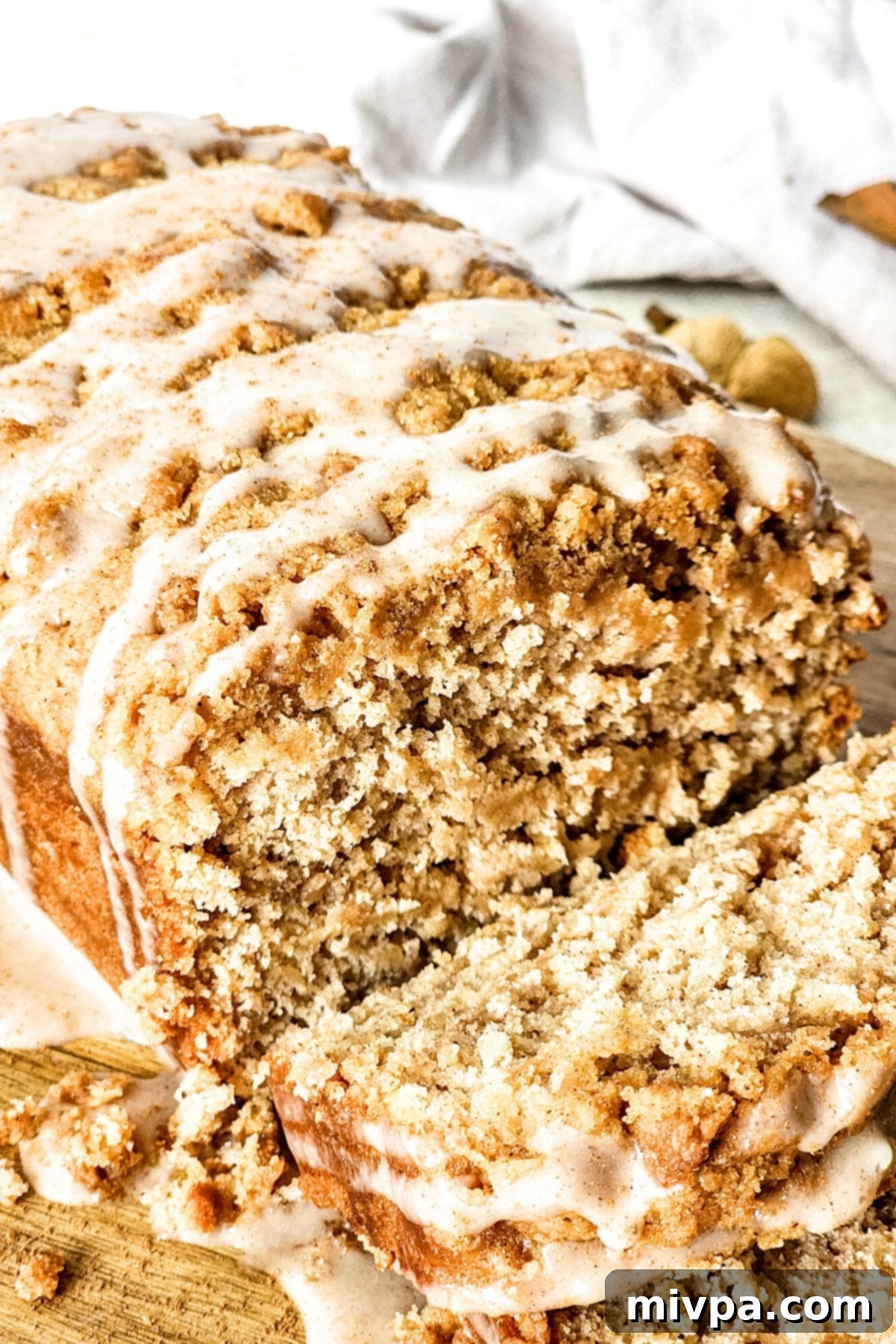 Gluten-Free Vegan Apple Bread A perfectly sliced loaf of gluten-free vegan apple bread, showing its moist texture.