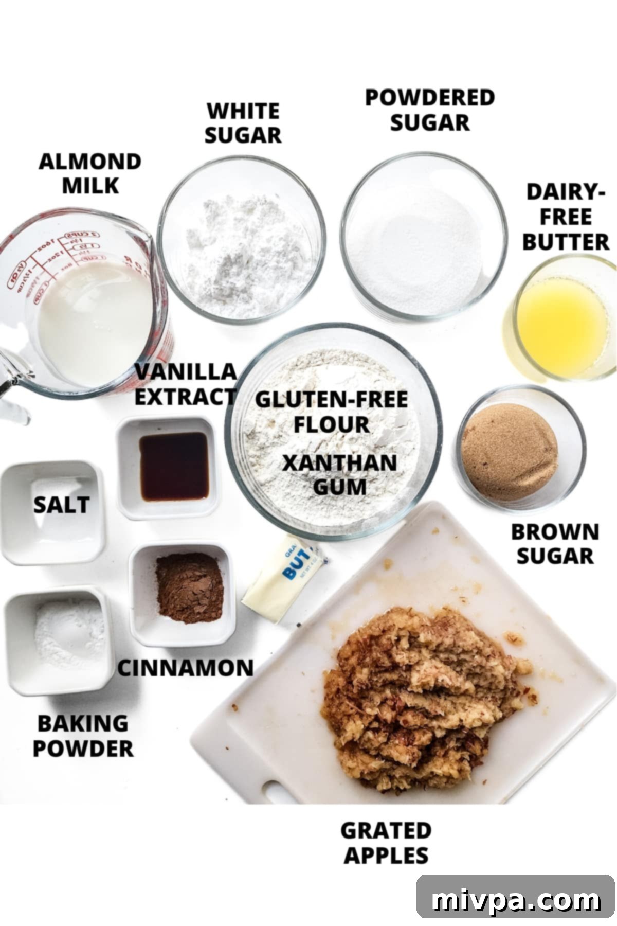 Gluten-Free Apple Bread Recipe (Vegan) All ingredients for the gluten-free apple bread recipe neatly laid out on a white board.