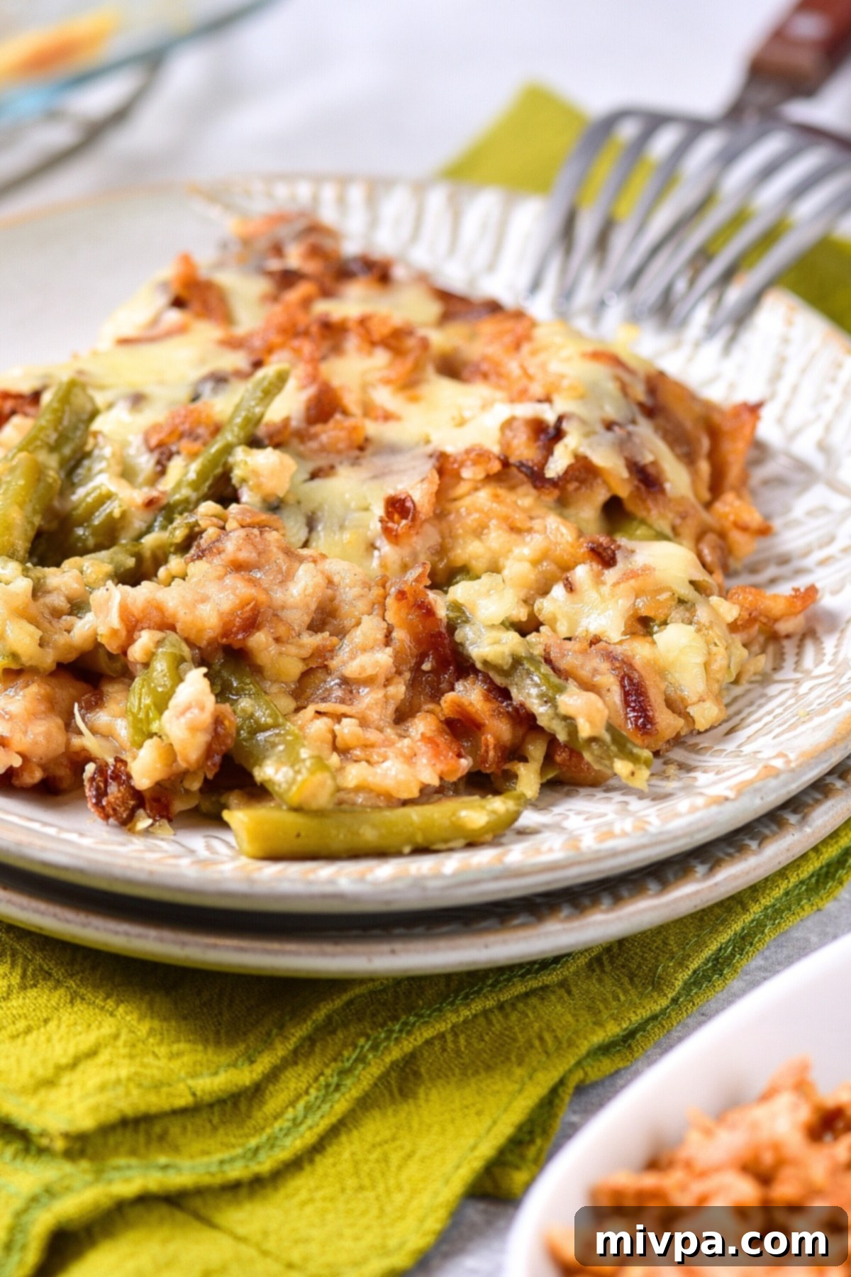 A portion of gluten-free green bean casserole on plate.
