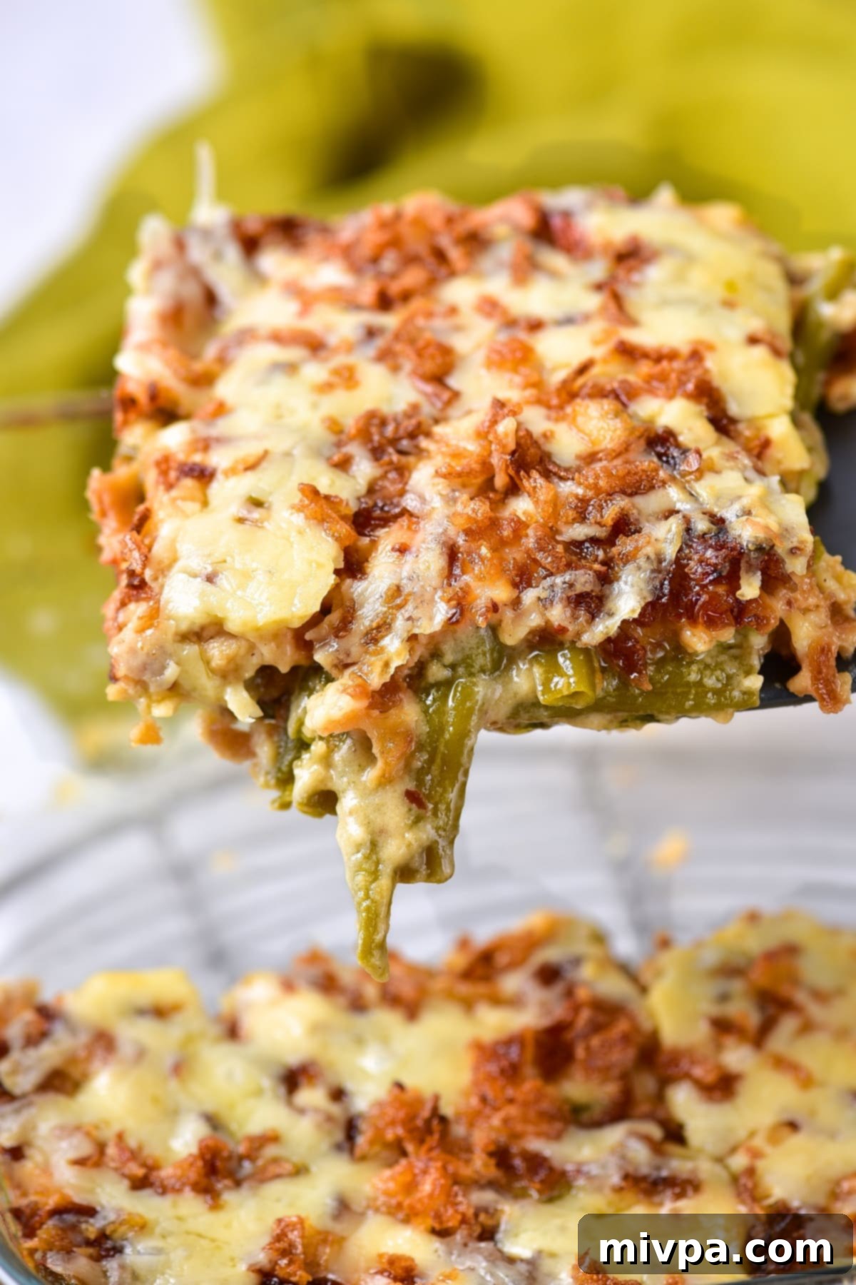 Holding up a portion of gf green bean casserole.