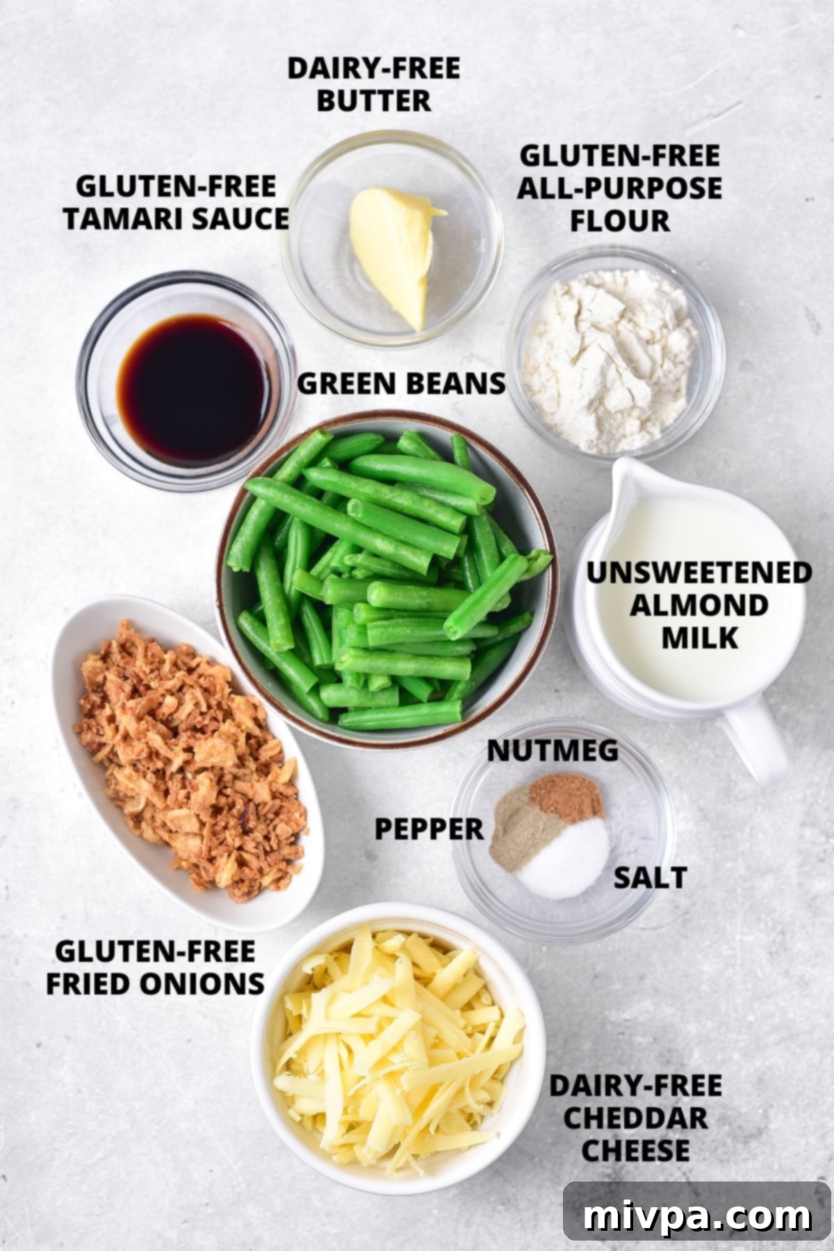 Ingredients for gluten-free green bean casserole recipe laid out on board.