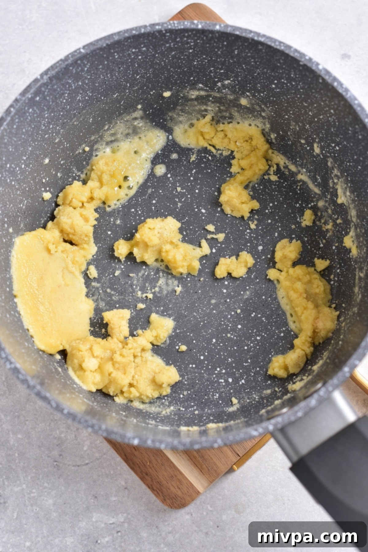 Cooking a mixture of butter and flour.