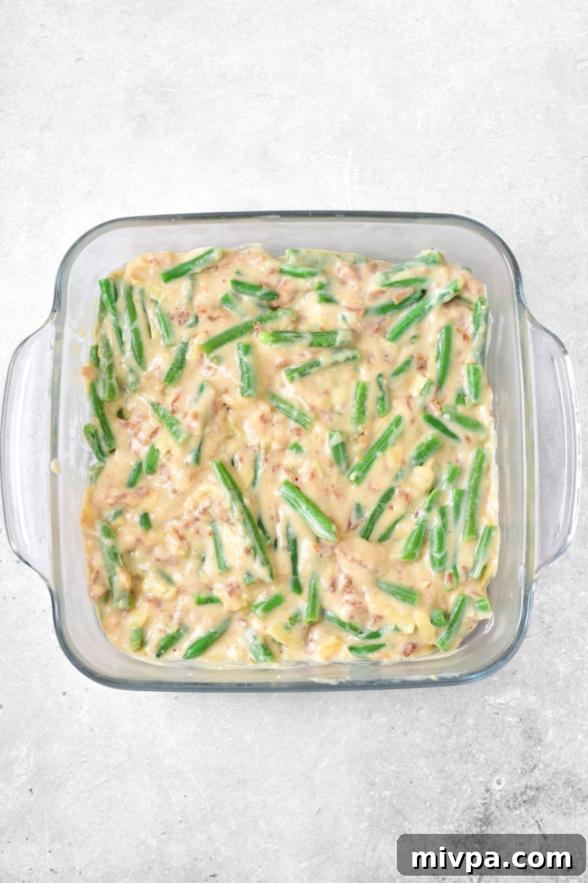 Green bean mixture in glass baking dish.